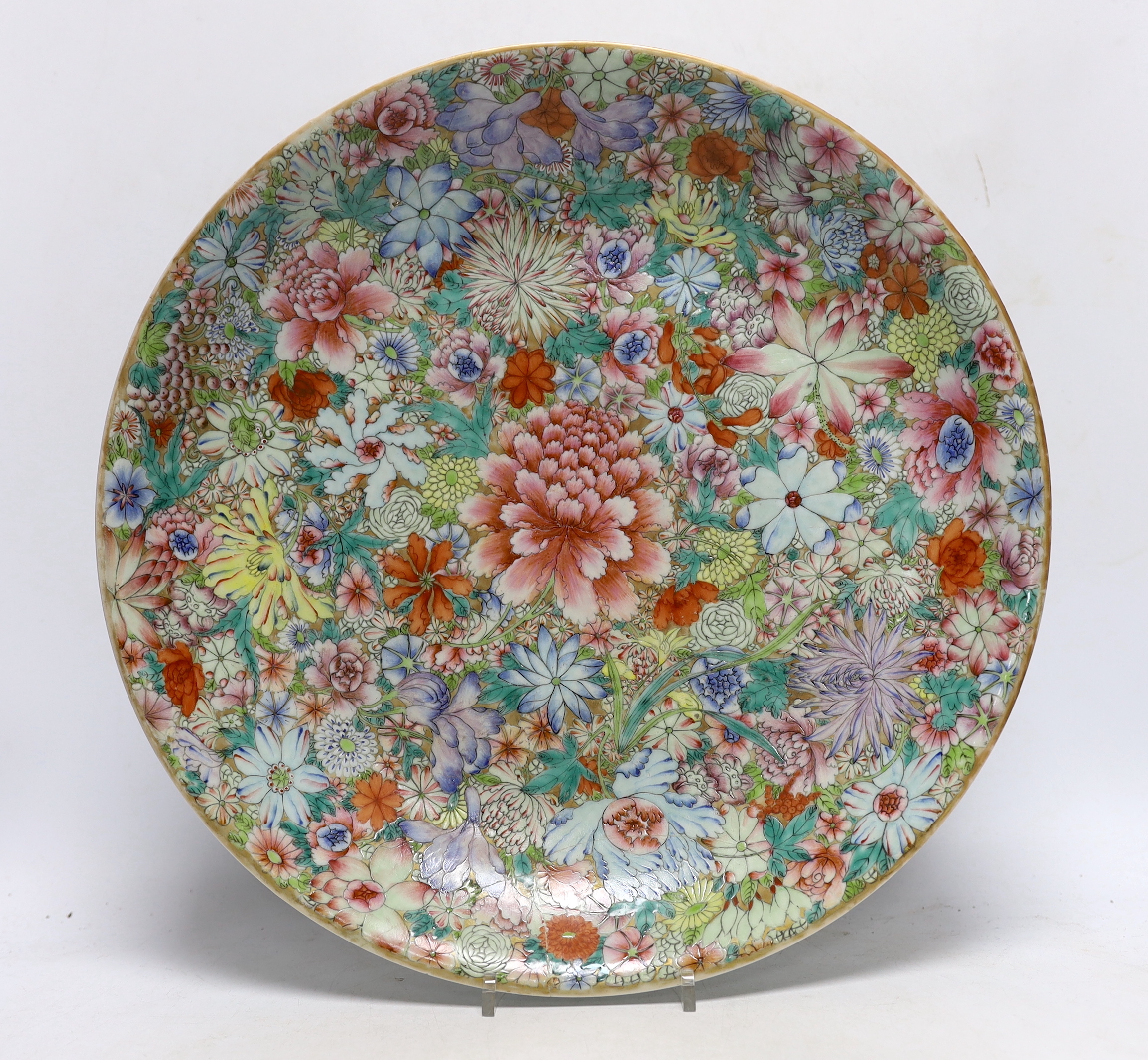 A Chinese millefleur enamelled porcelain dish, six character Qianlong seal mark, but late 19th/early 20th century, 38cm diameter and a Korean celadon vase